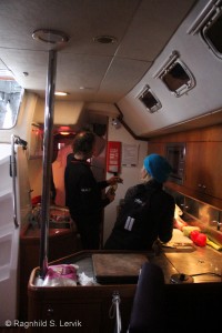 Jens and Åsa in the galley, cooking supper. 